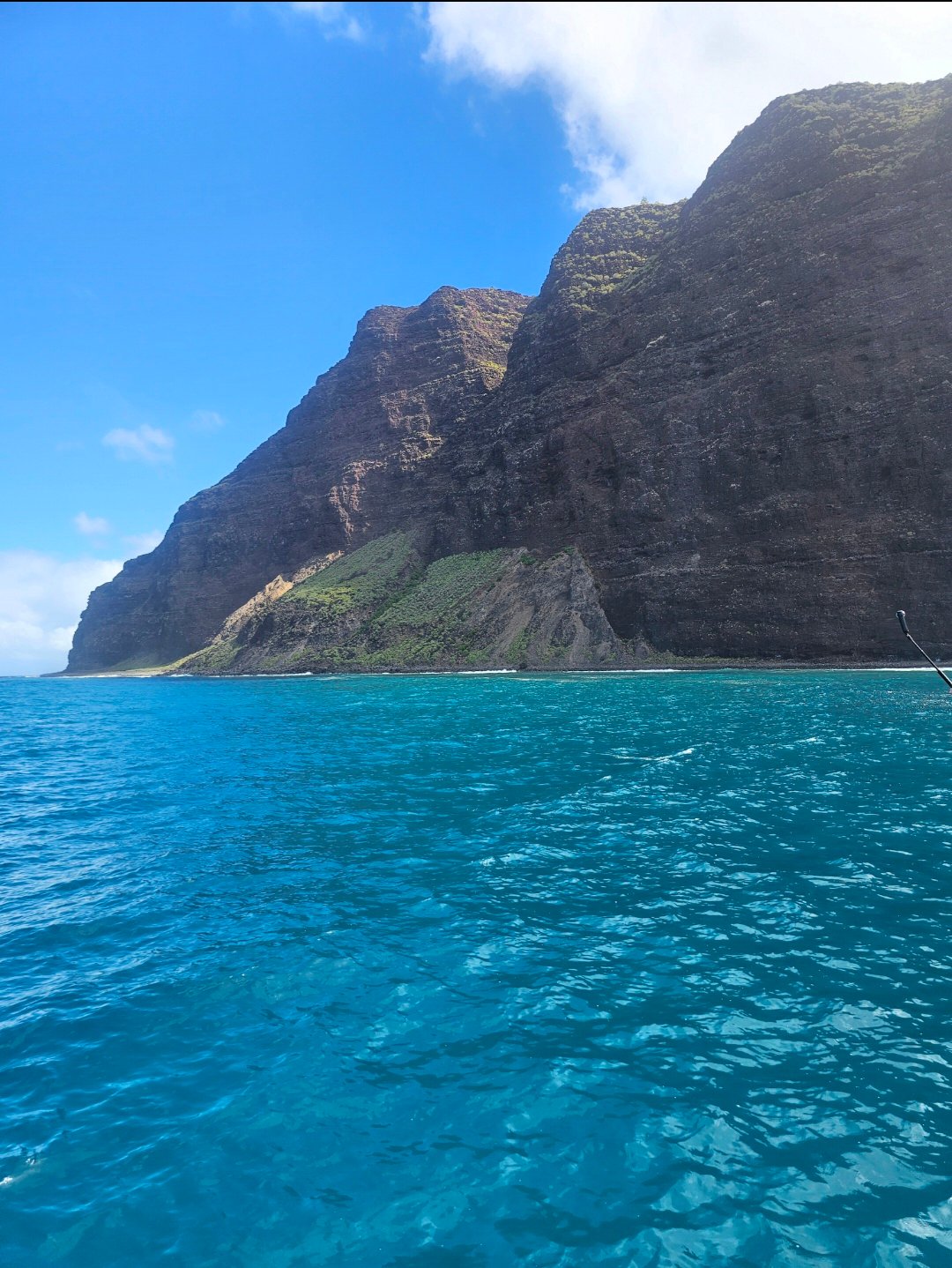 Na Pali Coast cliffs on Kauai with turquoise ocean