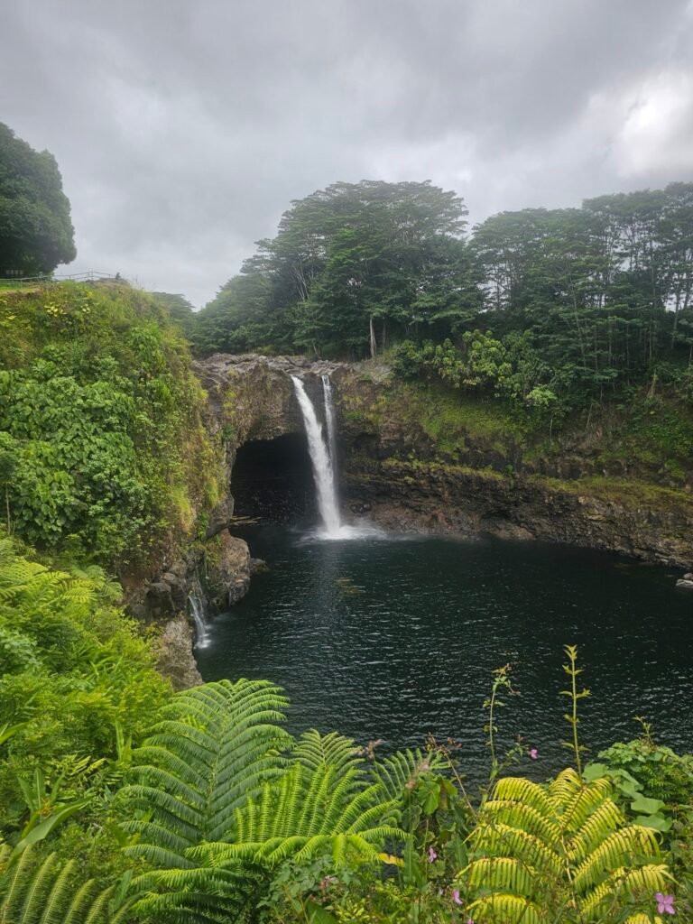 Waterfall surrounded by lush tropical greenery in Hawaii