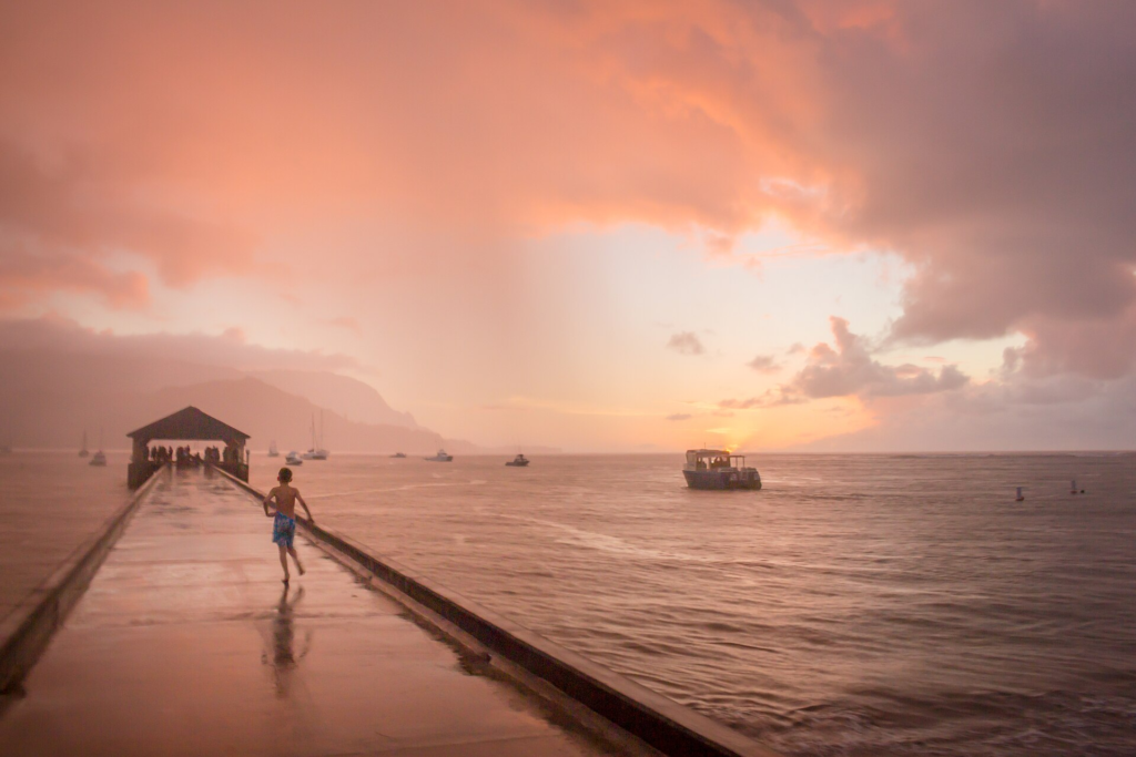 Kauaʻi Travel Guide Hanalei Bay with green mountains in the background on Kauaʻi