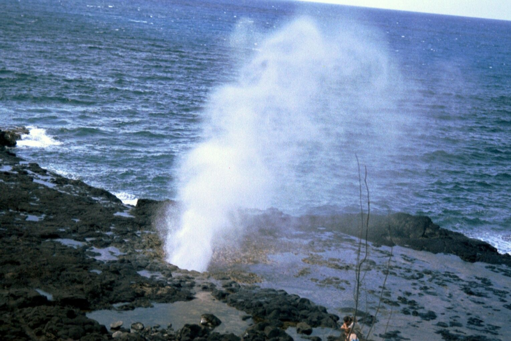 Kauaʻi Travel Guide Spouting Horn blowhole spraying ocean water on the south coast of Kauaʻi